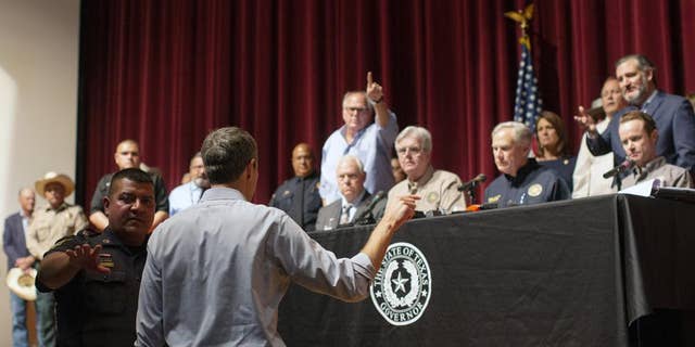 Democratic gubernatorial nominee Beto O'Rourke of Texas, who's challenging GOP Gov. Greg Abbott in November's election, interrupts a news conference headed by Abbott in Uvalde, Texas, on May 25, 2022.