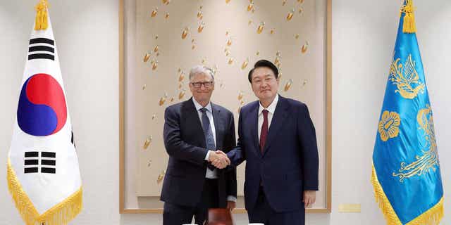 Bill Gates (left) meets with South Korean President Yoon Suk-yeol (right) in the Presidential office in Seoul, South Korea, on Aug. 16, 2022, to discuss their plans to expand their global health partnership.