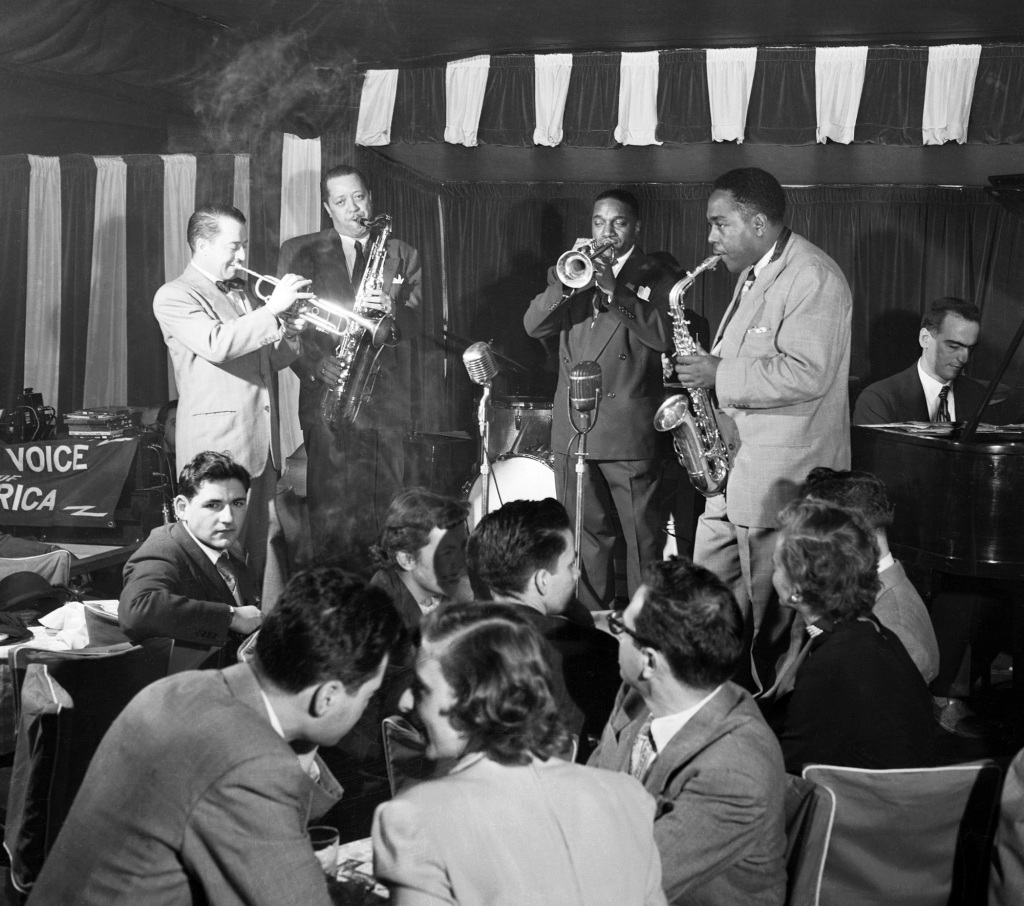 A show at Birdland Restaurant on December 16, 1949. From left to right, trumpeter Max Kaminsky, saxophonist Lester Young, "Hot Lips" Page, Charlie Parker on the alto sax, and pianist Lennie Tristano.