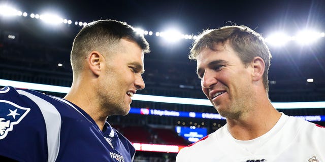 Tom Brady, left, of the New England Patriots greets Eli Manning of the New York Giants after a preseason game at Gillette Stadium on Aug. 29, 2019, in Foxborough, Massachusetts.