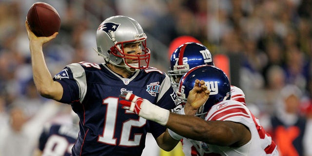 Quarterback Tom Brady of the New England Patriots passes against the New York Giants during Super Bowl XLII at the University of Phoenix Stadium in Glendale, Arizona, on Feb. 3, 2008.