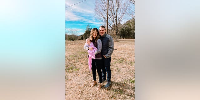 Kirsten Bridegan and her slain husband, Jared Bridegan, pose with daughter Bexley.