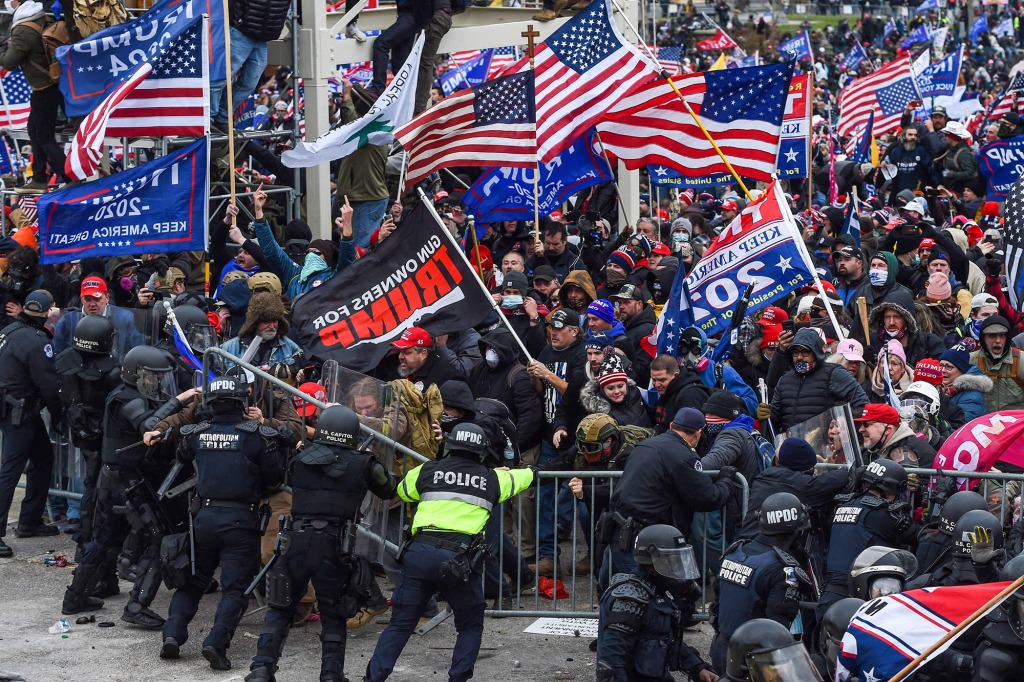 In this file photo taken on January 06, 2021, Trump supporters battle with police and security forces as they storm the US Capitol building in Washington, DC.