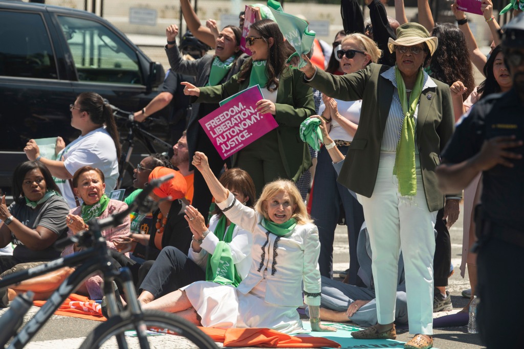 Rep. Carolyn Maloney participates in civil disobedience for abortion rights with other members of Congress and activists in front of the Supreme Court on July 19.