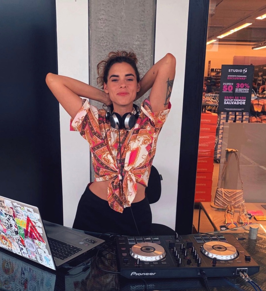 Ana Julieta working as a DJ.