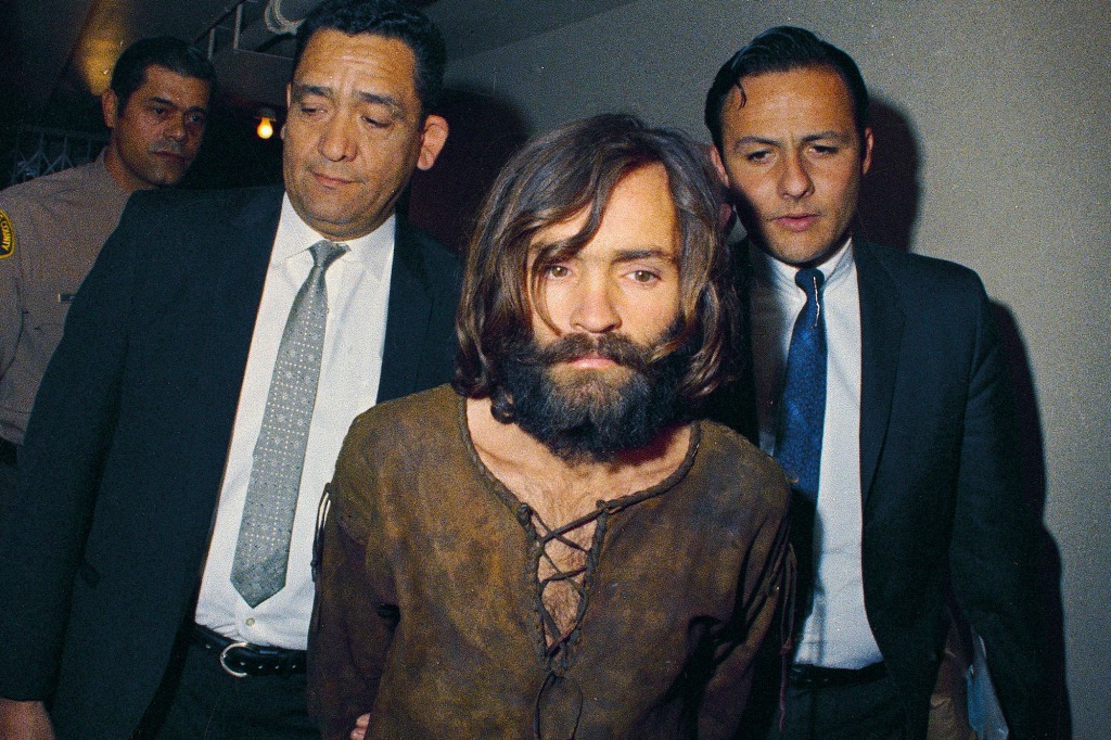  In this 1969, file photo, Charles Manson is escorted to his arraignment on conspiracy-murder charges in connection with the Sharon Tate murder case. 