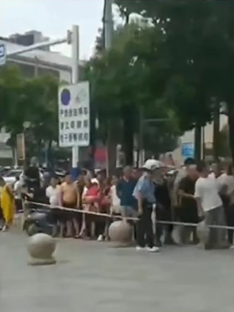 A crowd at a scene of a deadly attack on a kindergarten in Jiangxi province.