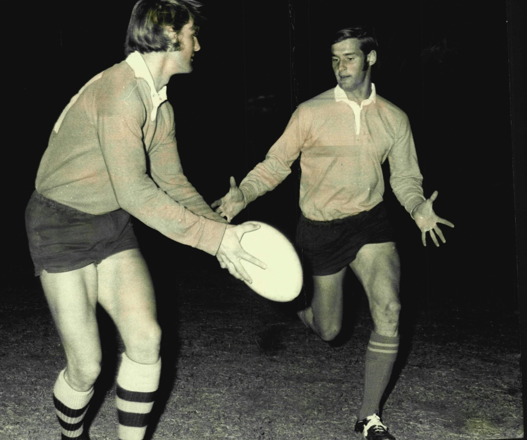 Chris Dawson, left, passing to his brother Paul Dawson in 1970.