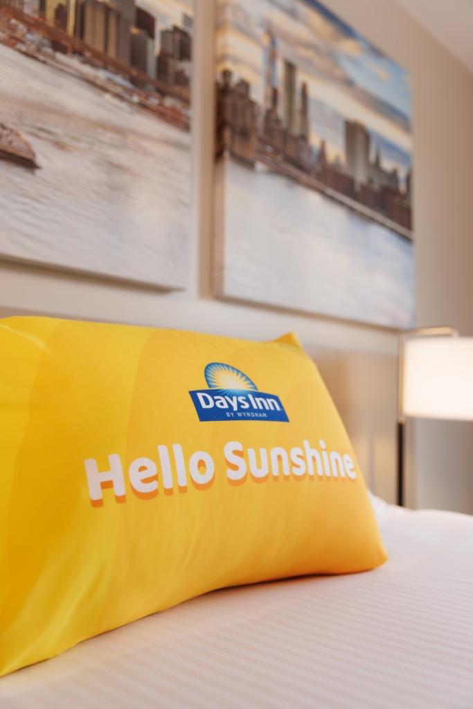 The talking pillow on a bed at the Days Inn.