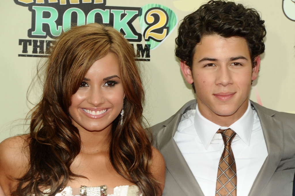 Nick Jonas with Demi Lovato at the "Camp Rock: The Final Jam" premiere in 2010.
