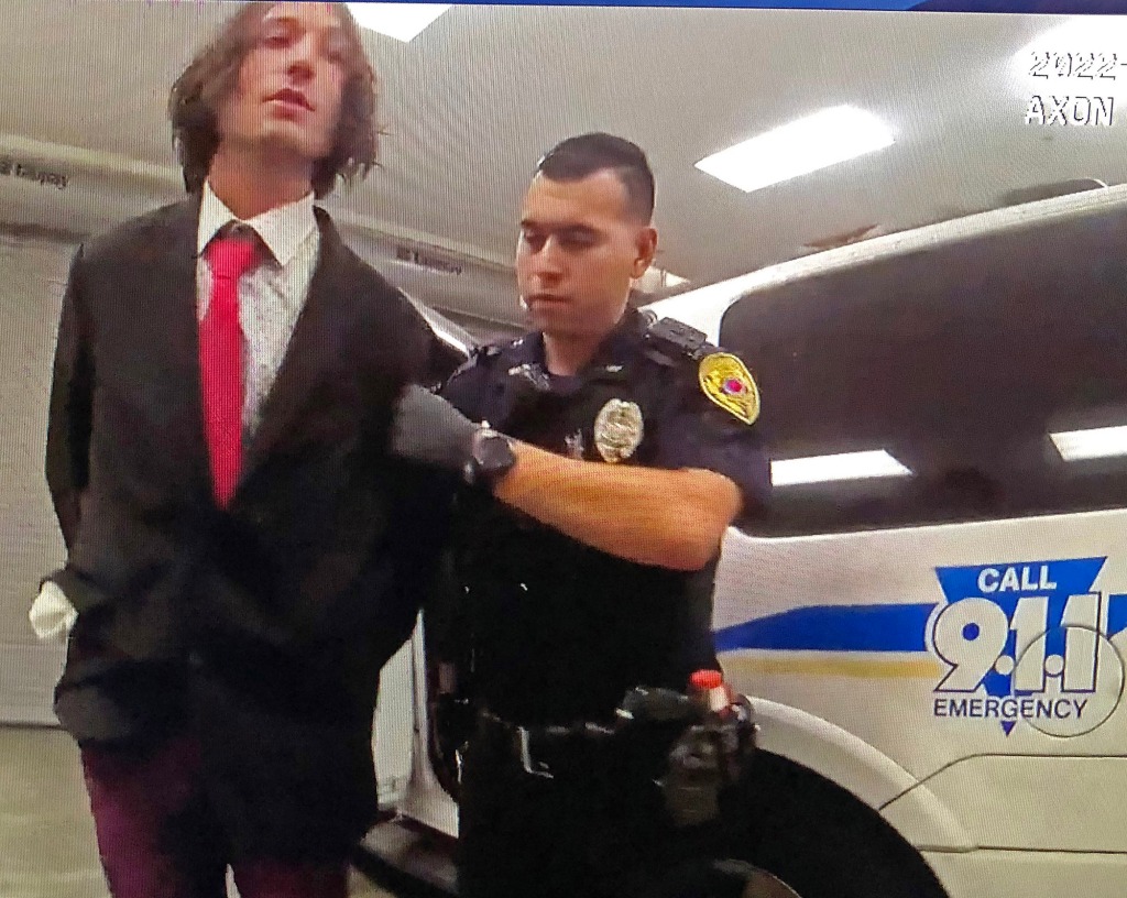 Miller is arrested by police.
