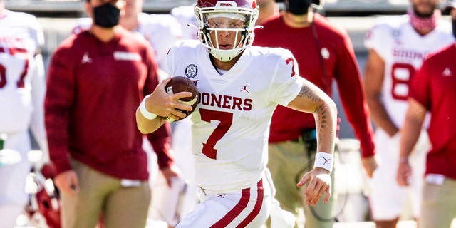 Oklahoma quarterback Spencer Rattler (7) carries the ball during the first half of an NCAA college football game against TCU, Saturday, Oct. 24, 2020, in Fort Worth, Texas.