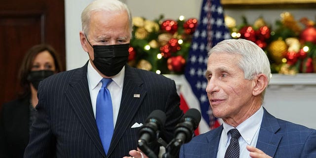 Dr. Anthony Fauci, right, with President Biden, speaks during a briefing on the omicron COVID-19 variant at the White House on Nov. 29, 2021.