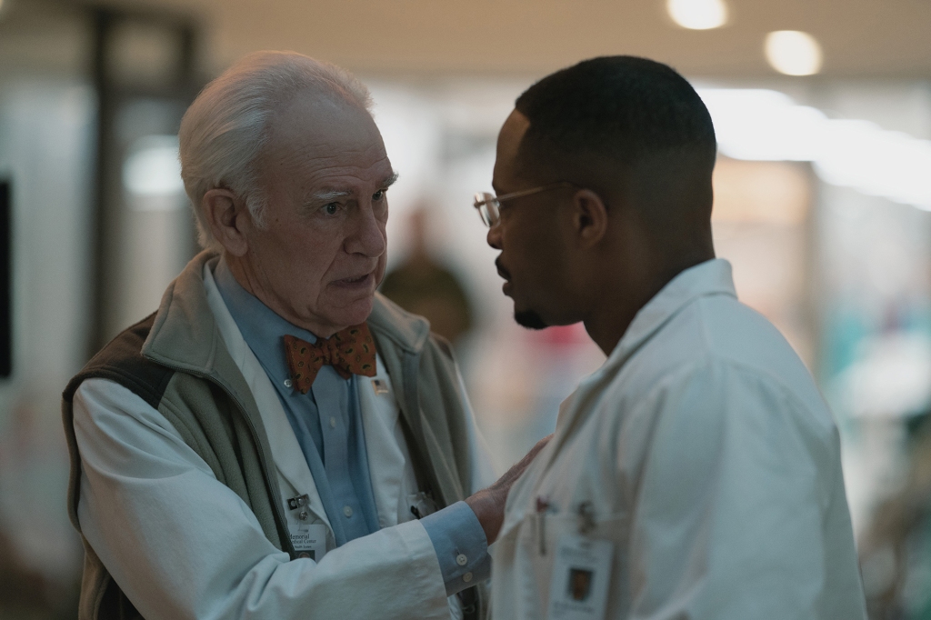 Robert Pine and Cornelius Smith Jr. as Dr. Horace Baltz and Dr. Bryant King. Pine has his hand on Smith's shoulder in a reassuring manner.