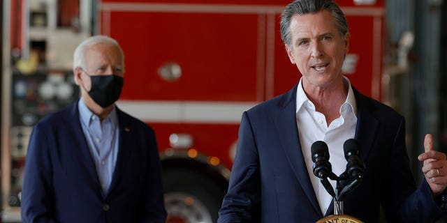 California Gov. Gavin Newsom speaks as President Joe Biden looks on. Biden has said he expects to run for a second term.