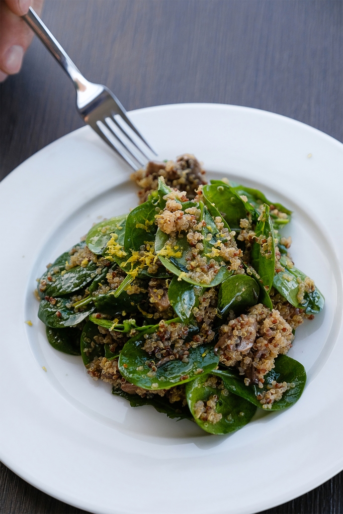 A vegan dish featuring salad with Quinoa and herbs.