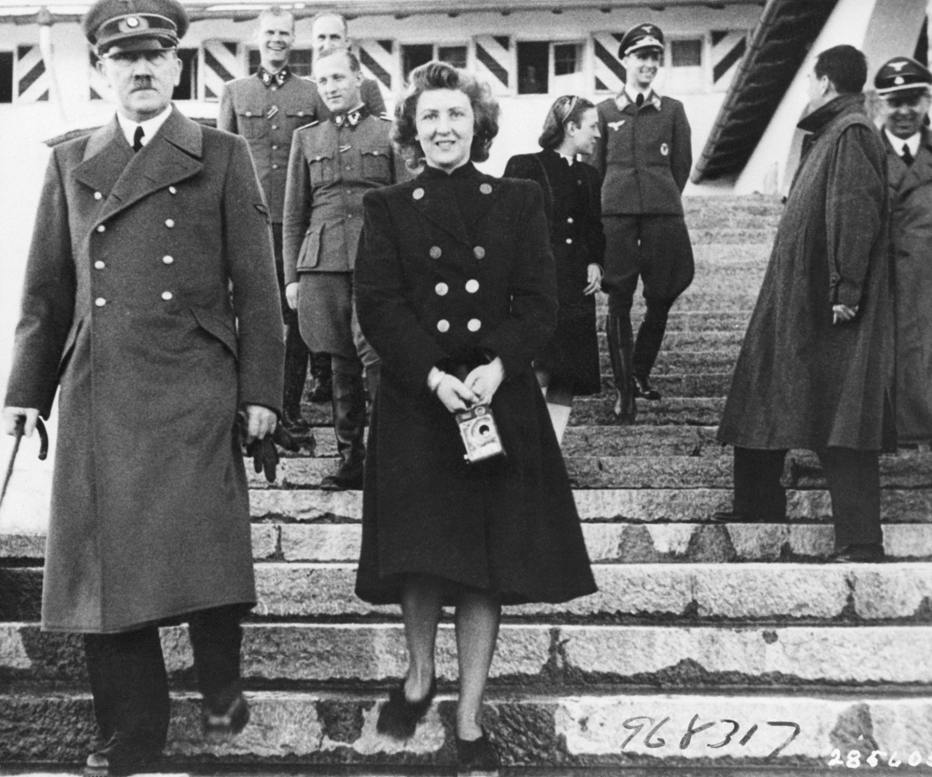 Adolf Hitler with Eva Braun, his mistress and later presumed wife, who played second fiddle to Mitford. 