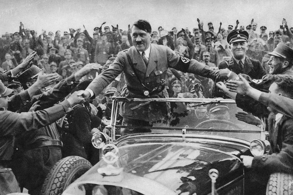 Hitler is welcomed by supporters at Nuremberg.