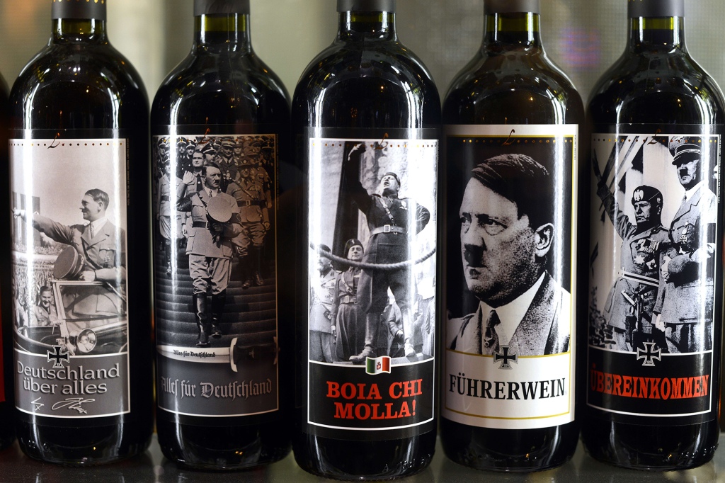 Bottles of wine with stickers showing pictures of dictators as Adolf Hitler, Mussolini or il Duce are exhibited in a shop window, on March 26, 2014 in Rome.