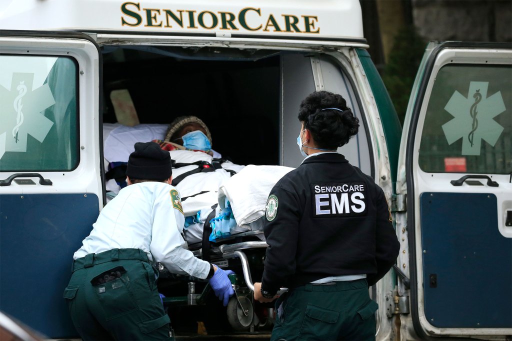  Emergency Medical Service workers unload a patient out of their ambulance at the Cobble Hill Health Center on April 18, 2020 in the Cobble Hill neighborhood of the Brooklyn.