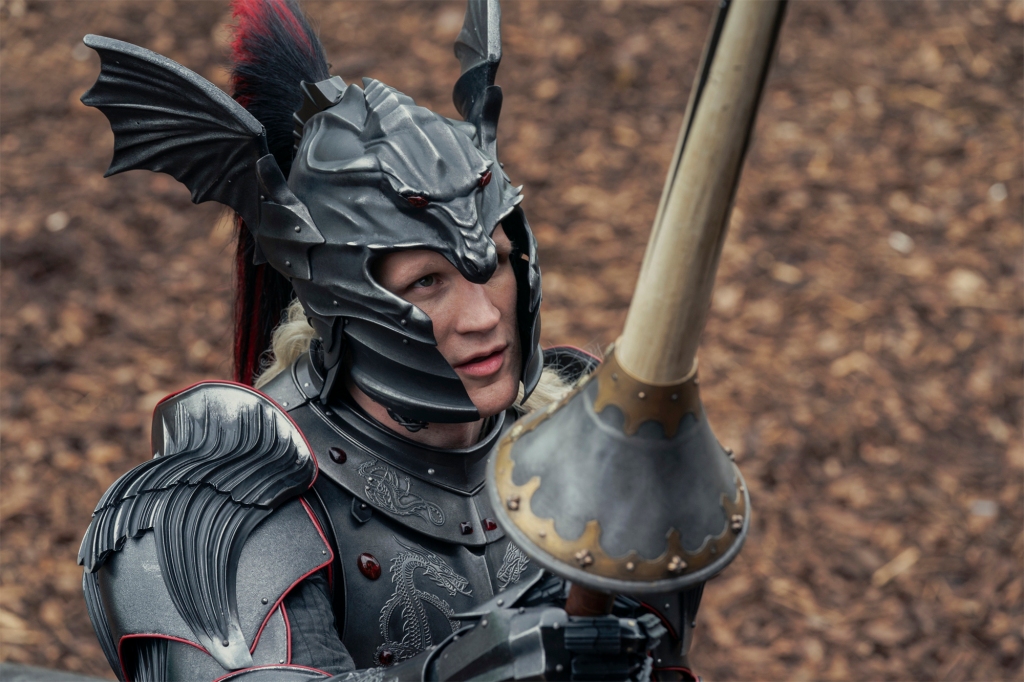 Matt Smith wearing a helmet holding a sword. 