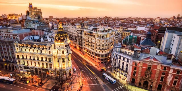 Aerial view of Gran Via in Madrid at dusk from Circulo de Bellas artes. Spain