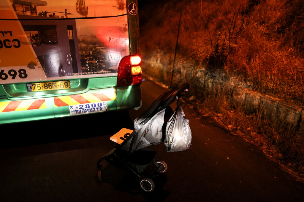 A pram is seen near a bus following an incident in Jerusalem August 14, 2022