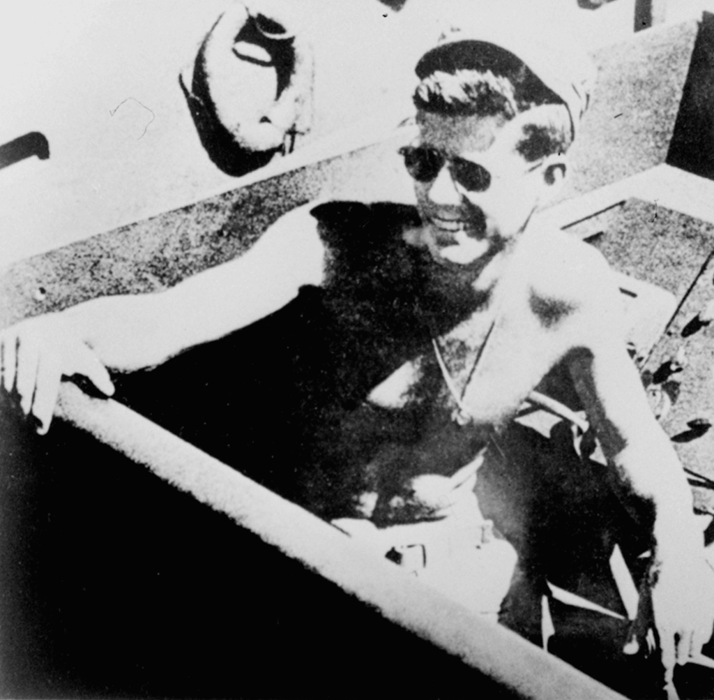 Lt. John F. Kennedy, skipper of PT boat 109, is shown relaxing in the South Pacific, 1943. Six decades after Aaron Kumana helped rescue young U.S. naval officer John F. Kennedy from Japanese capture in 1943, the U.S. Navy officially recognized its debt to the Solomon Islander Wednesday Aug. 22, 2007, who for years was believed dead and not honored.