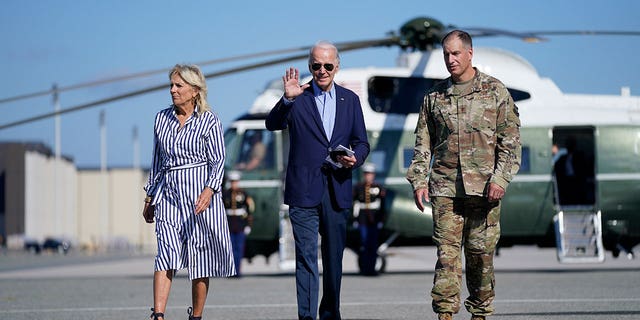 President Biden and first lady Jill Biden walk to board Air Force One for a trip to Kentucky to view flood damage Aug. 8, 2022, at Dover Air Force Base in Dover, Delaware. 