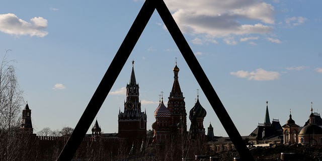 The Kremlin's Spasskaya Tower and St. Basil's Cathedral are seen through the art object in Zaryadye park in Moscow, Russia March 15, 2022. (REUTERS/Evgenia Novozhenina/File Photo)