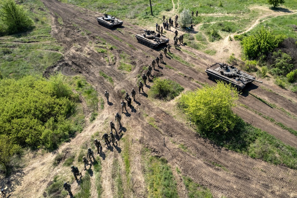 Ukrainian infantrymen take part in a training exercise with tanks