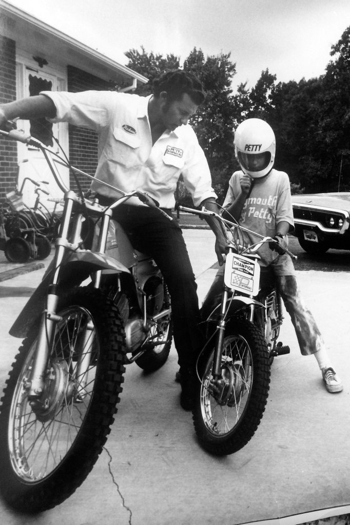 Kyle with his father in 1969, getting his first taste of speed.