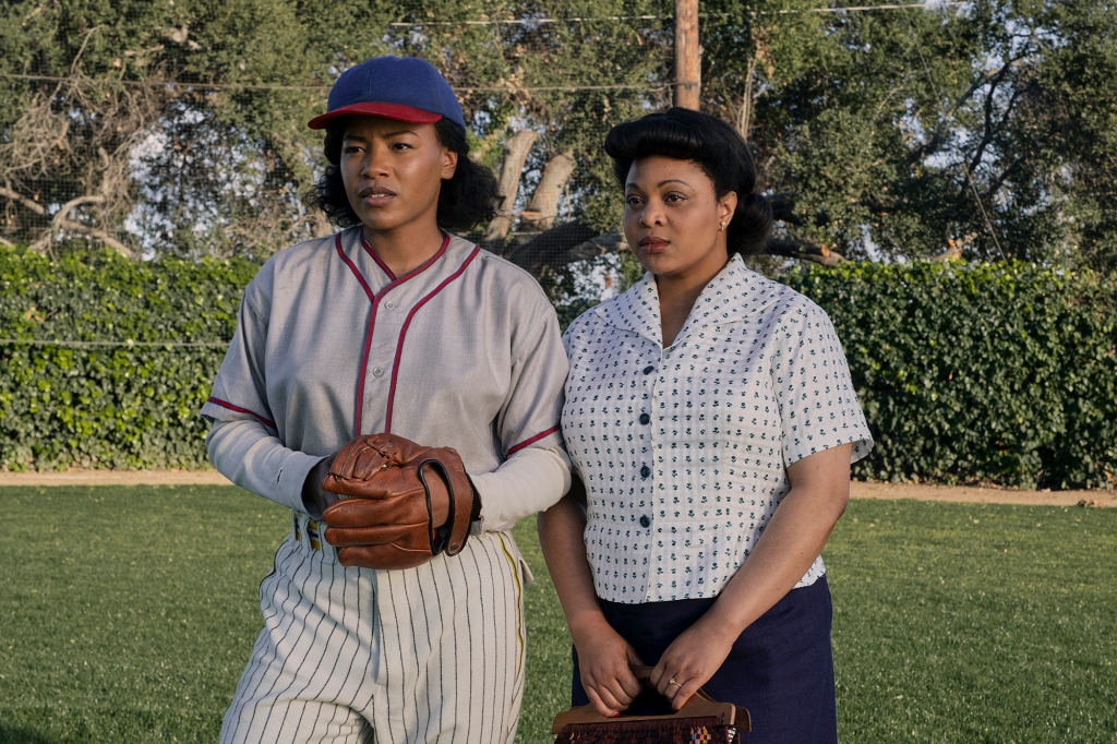 Pitcher Max (Chanté Adams) and her friend Clance (Gbemisola Ikumelo), right, stand on a field. 