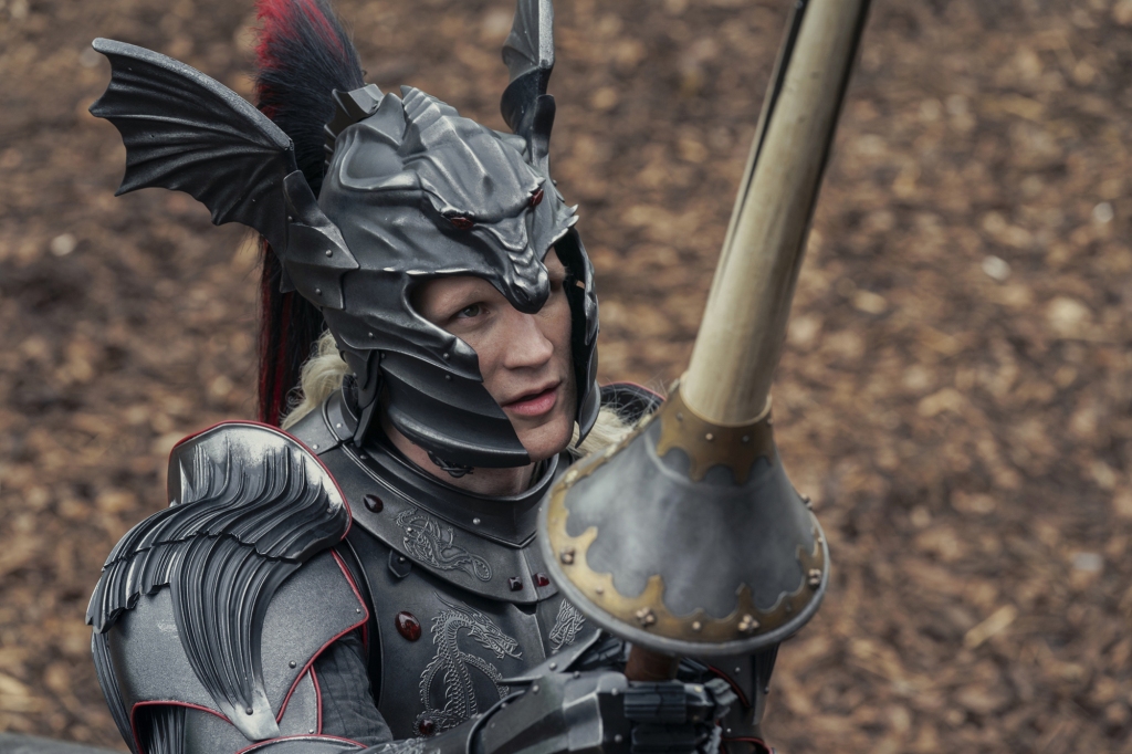 Matt Smith wearing a helmet holding a sword. 