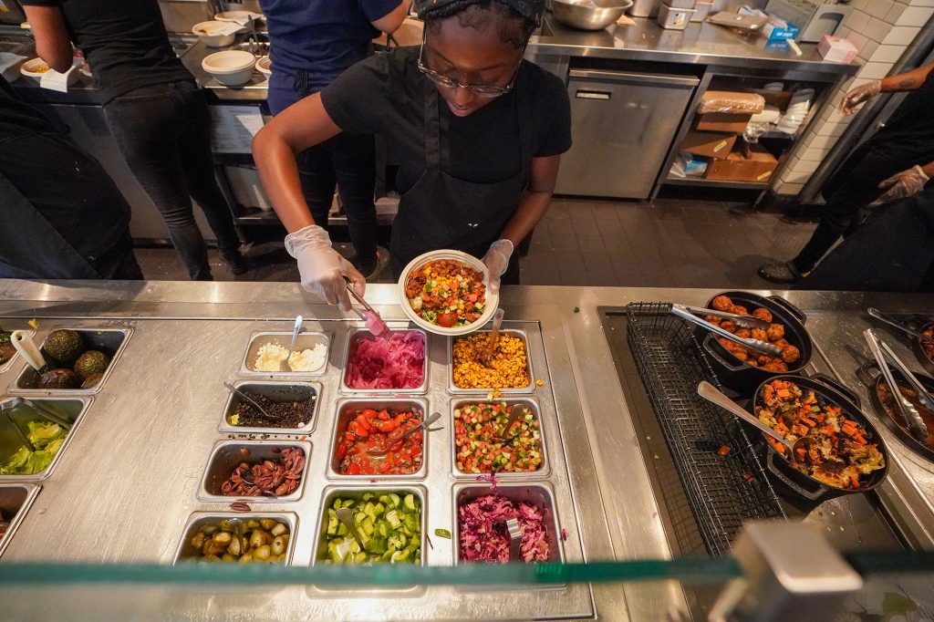 Fans of the Greek-inspired food say they don't mind waiting in long lines because the restaurant offers a healthy, inexpensive alternative to the greasy hot dog and pizza joints in midtown. 