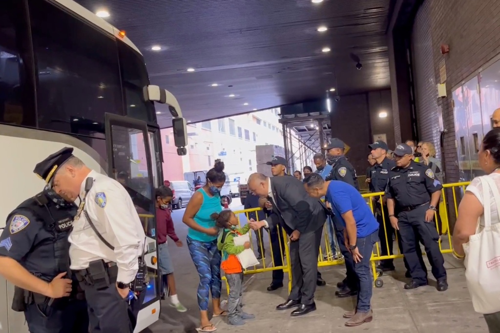 Migrants arrive by bus to Port Authority Bus Terminal early Friday, Aug. 12, 2022. 
