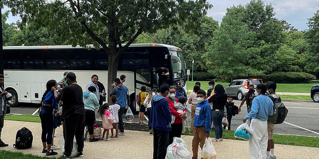 FILE PHOTO: Approximately 30 migrants disembark after arriving on a bus from Texas, at Union Station near the U.S. Capitol in Washington, U.S., July 29, 2022. REUTERS/Ted Hesson/File Photo