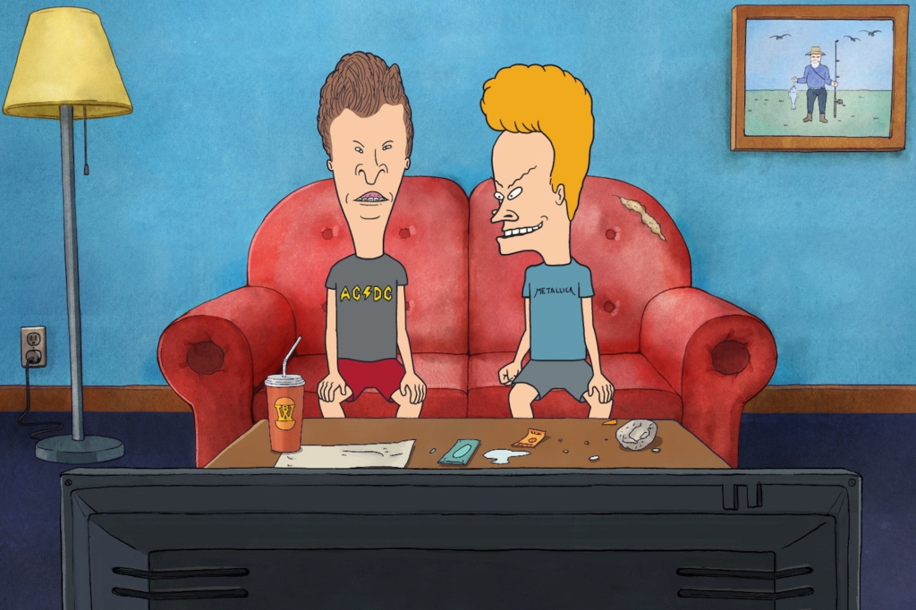Beavis and Butt-Head are sitting on a ratty red couch in front of a television set. Beavis is looking at Butt-Head. There's a soda with a straw on the table in front of them.