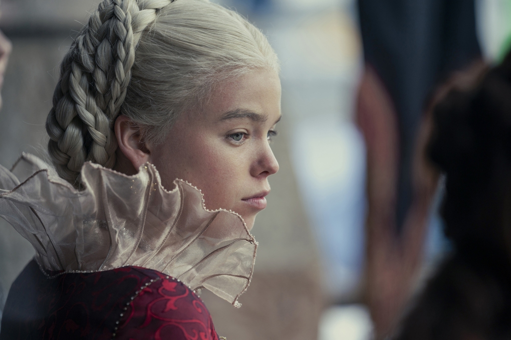 Milly Alcock in a side profile view wearing a frilly collar as Princess Rhaenyra Targaryen in "House of the Dragon."