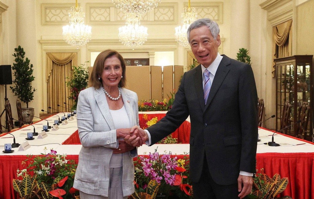 U.S. House Speaker Nancy Pelosi, left, and Prime Minister Lee Hsien Loong shake hands at the Istana Presidential Palace in Singapore, Monday, Aug. 1, 2022. 