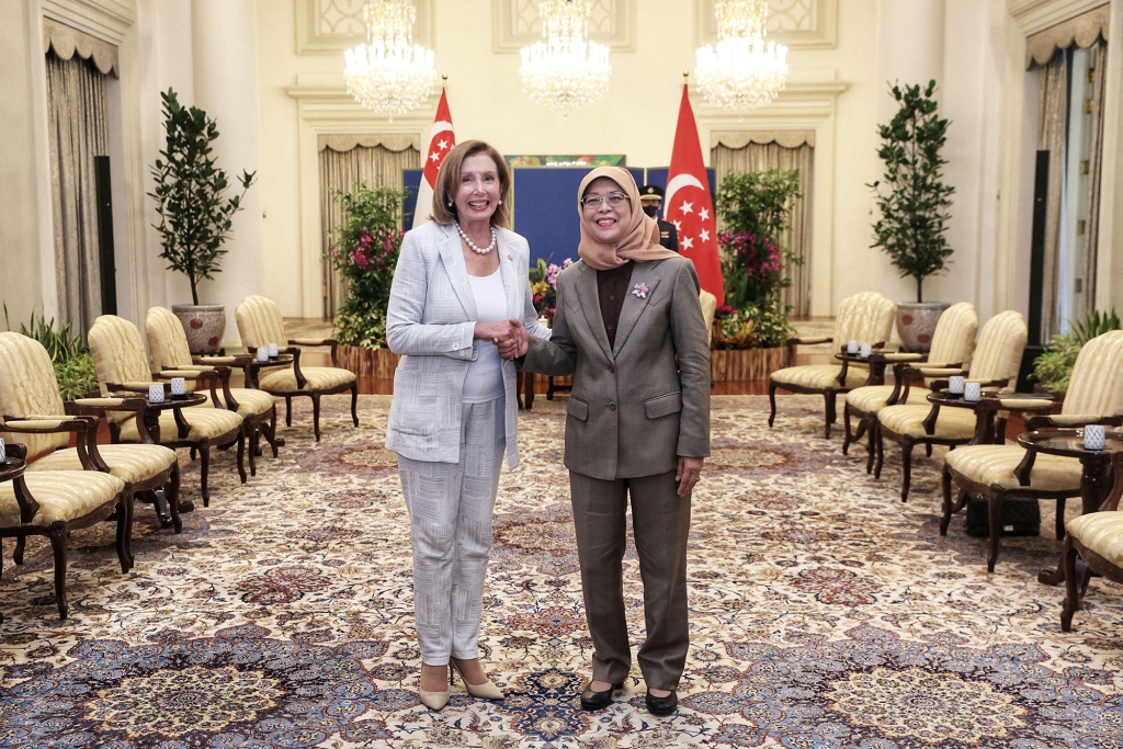 House Speaker Nancy Pelosi shakes hands with Singapore's President Halimah Yacob in Singapore on August 1, 2022.