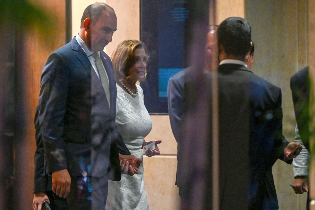 Speaker of the US House of Representatives Nancy Pelosi (2nd L) leaves the Shangri-La Hotel after a reception organised by the American Chamber of Commerce in Singapore on August 1, 2022.