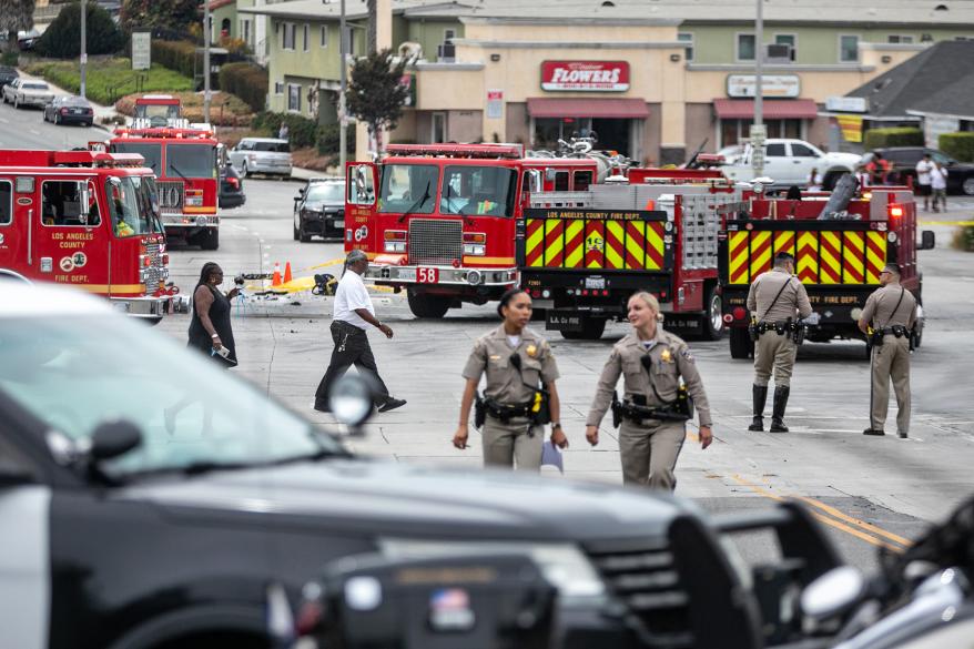 Police and firefighters at the scene of the car crash.