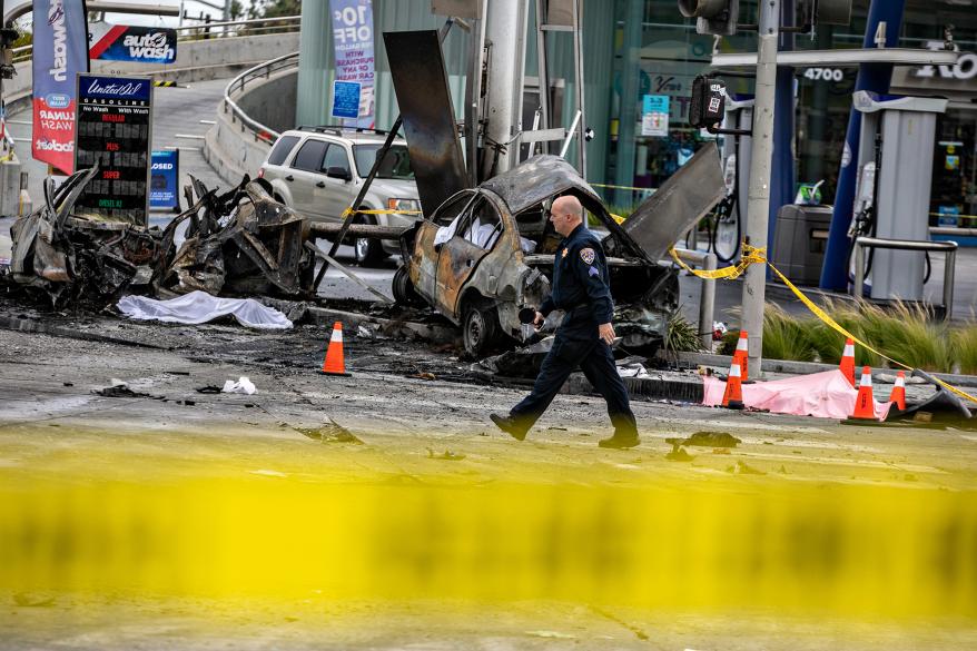 Police and firefighters at the scene of the car crash.