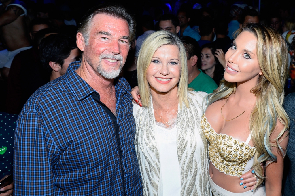 Newton-John died Monday morning surrounded by her loved ones, including husband John Easterling (left) and daughter Chloe Lattanzi (right). They are all pictured together in 2015. 