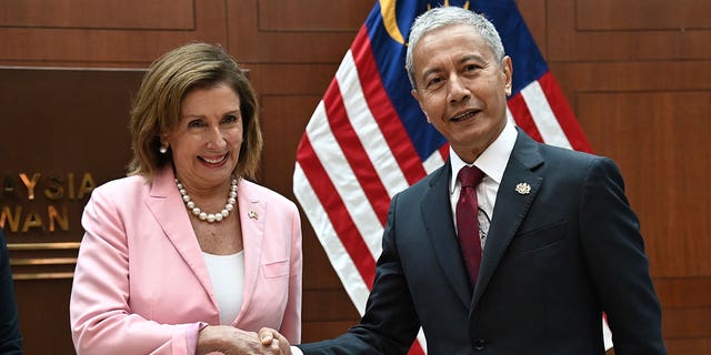 U.S. House Speaker Nancy Pelosi, left, meets with Malaysia Parliament speaker Azhar Azizan Harun at the parliament house in Kuala Lumpur, Tuesday, Aug. 2, 2022. Pelosi arrived in Malaysia on Tuesday for the second leg of an Asian tour that has been clouded by an expected stop in Taiwan, which would escalate tensions with Beijing. 