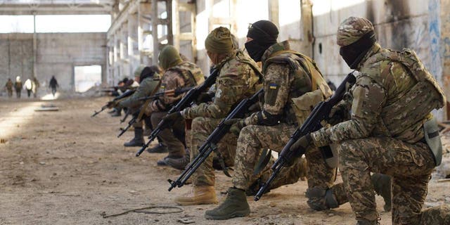 Soldiers of the Belarusian Kastus Kalinouski Regiment train in Ukraine.