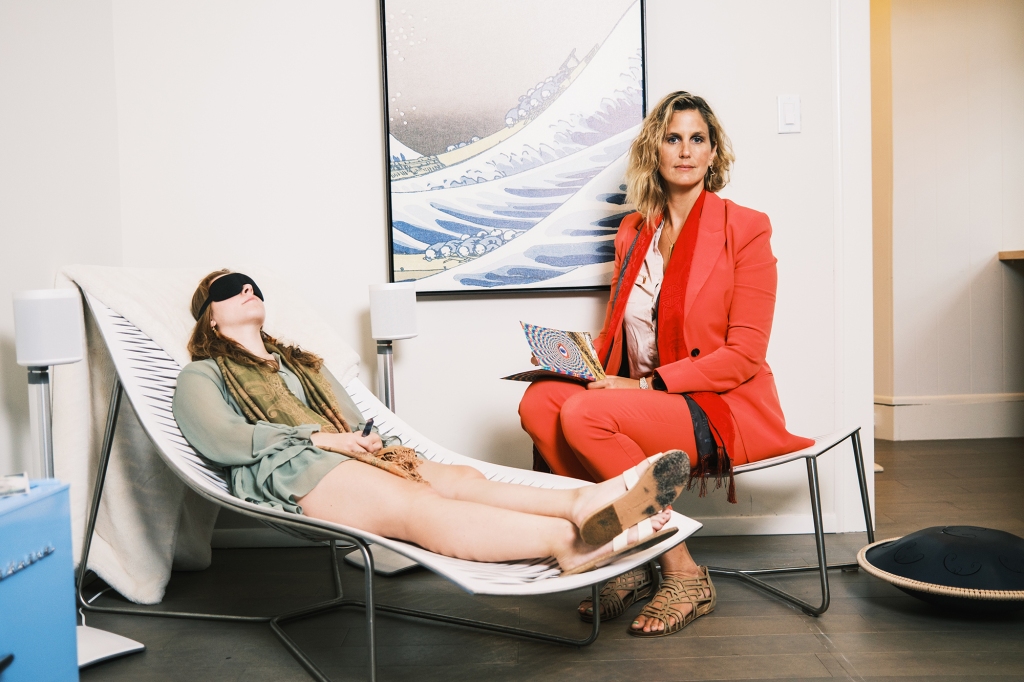 August 11, 2022 - Southampton, NY: 

Amalia von Alvensleben, 22, Chief Operations Officer, left, and Dr. Lia Lis, 46, founder and Medical Director, right,  demonstrate some of the procedures, which involve taking low doses of Ketamine and guided meditation, journaling and sound therapy. 

Dr. Lia Lis, a double board-certified Adult and Child Psychiatrist, has begun treating patients with psychoactive drugs such as Ketamine to overcome depression, suicidal ideation and PTSD. 

Her Southampton practice combines traditional therapy with low doses of psychoactive drugs as well as more spiritual activities that help guide the patient through past trauma and psychological issues. 