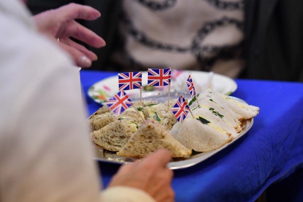 The sandwiches are made from bread with a little butter and a spread of jam, then cut out into circles the size of an old British penny.