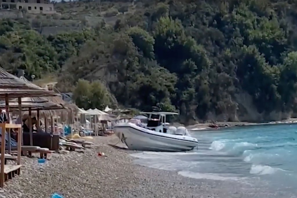 The boat that allegedly killed a 7-year-old British girl sits on an Albanian beach.